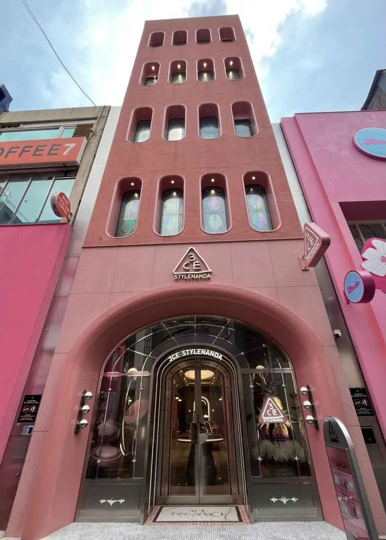 A Tax Refund Eligible Store in Myeongdong 3CE Stylenanda flagship store facade in Myeongdong, Seoul, a K-beauty brand offering tax refund on purchases