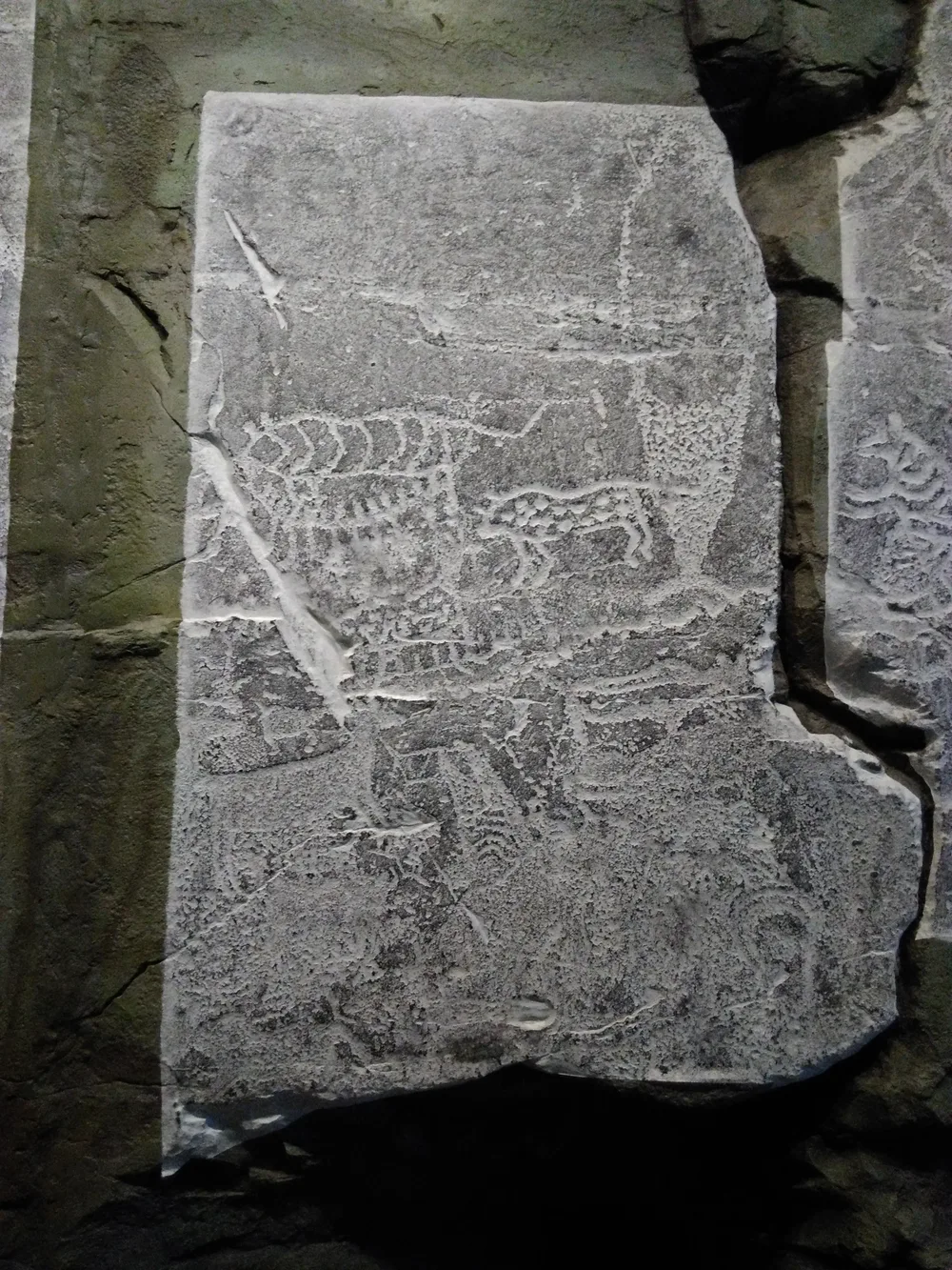A full-scale replica of the Bangudae petroglyphs near Ulsan, showing carved outlines of animals on stone