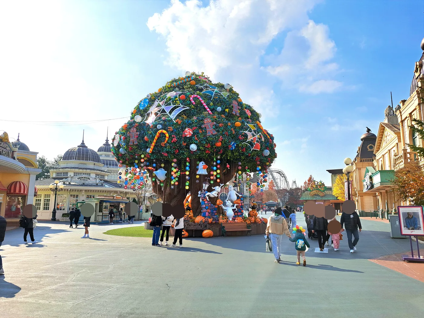 The entrance plaza at Everland theme park in Yongin, Korea, with a large decorated tree centerpiece and European-style buildings