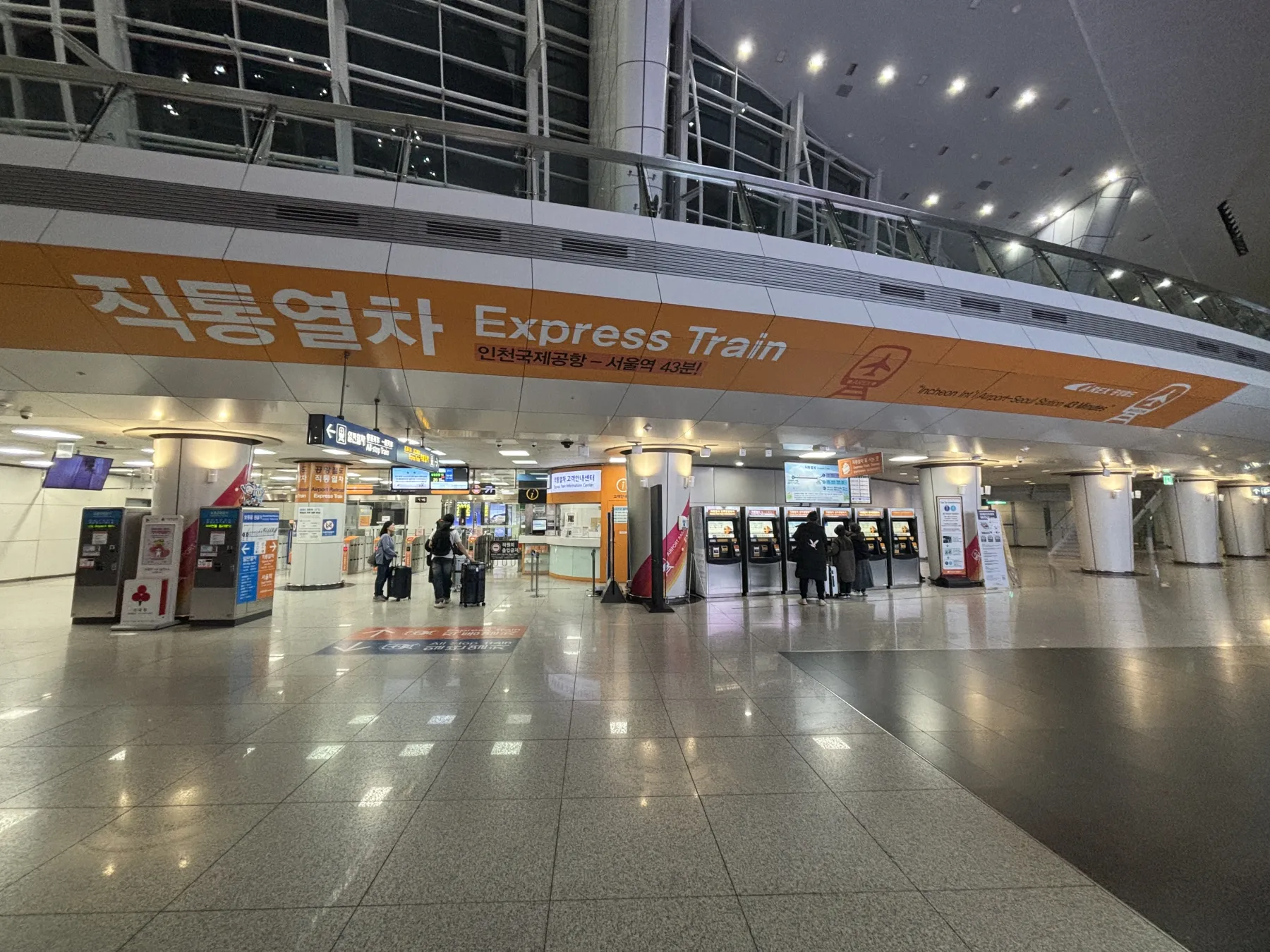 Express Train concourse signage at Incheon Airport reading Incheon International Airport to Seoul Station 43 minutes