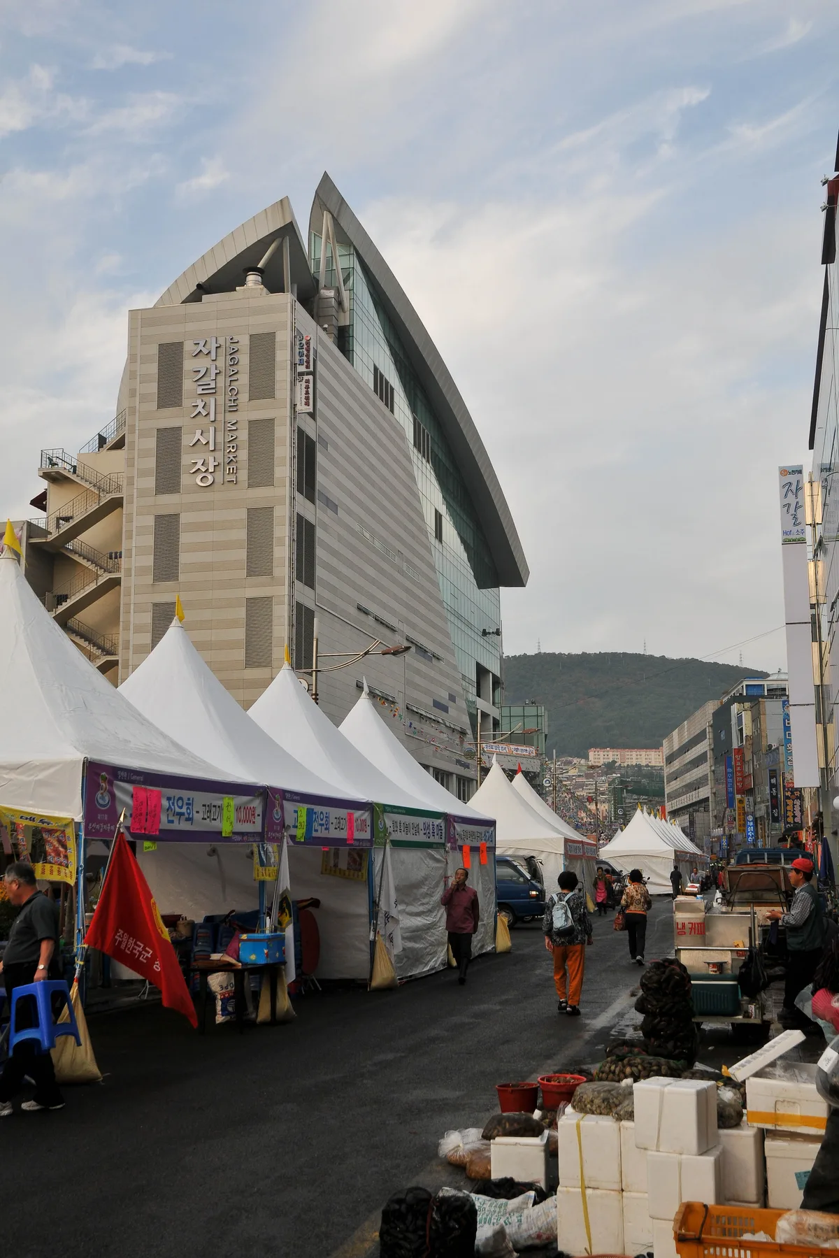 Jagalchi Fish Market, Busan The exterior of Jagalchi Fish Market in Busan, South Korea, with market tents and stalls lining the street